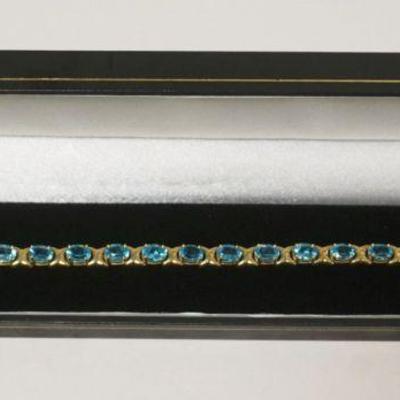 1177	14K BLUE TOPAZ BRACELET, 10.99 DWT INCLUDING STONES, APPROXIMATELY 7 IN L
