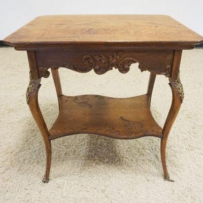 1121	ORNATE CARVED OAK LAMP TABLE W/METAL MOUNTS, APPROXIMATELY 24 IN X 30 IN X 30 IN HIGH
