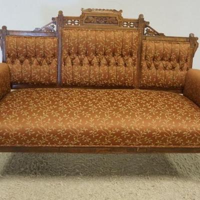 1134	WALNUT VICTORIAN UPHOLSTERED SETTEE W/CARVED CREST & TUFTED BACK, APPROXIMATELY 58 IN X 24 IN X 40 IN HIGH

