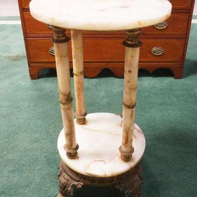 1122	ONYX PEDESTAL HAVING 4 COLUMNS AT CENTER MOUNTED ON ORNATE CAST METAL BASE, APPROXIMATELY 16 IN X 30 IN HIGH
