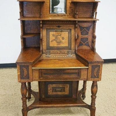 1150	UNUSUAL OAK FALL FRONT DESK W/CARVED IMAGES OF FLOWERS, LEAVES, CATTAILS & QUARTER MOONS, SOME OLD REPAIRS, APPROXIMATELY 35 IN...