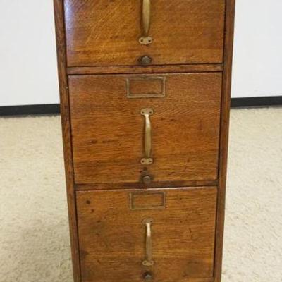 1115	TIGER OAK 4 DRAWER FILE CABINET W/PANELED SIDES, APPROXIMATELY 16 IN X 27 IN X 52 IN HIGH
