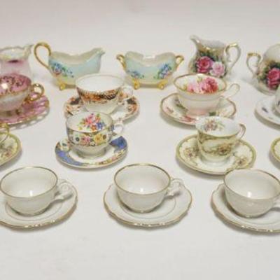 1033	GROUP OF ASSORTED CHINA INCLUDING DECORATED CREAMERS & SUGARS, CUPS & SAUCERS
