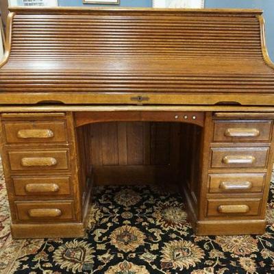 1105	OAK ROLL TOP DESK W/SWIVEL OAK CHAIR, PANELED SIDES & BACK, APPROXIMATELY 60 IN X 32 IN X 51 IN HIGH

