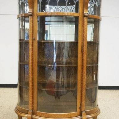 1118	OAK CHINA CABINET, CURVED GLASS, BOW FRONT W/CARVED LION HEADS & LEADED GLASS TOP & 4 ADJUSTABLE SHELVES, APPROXIMATELY 42...