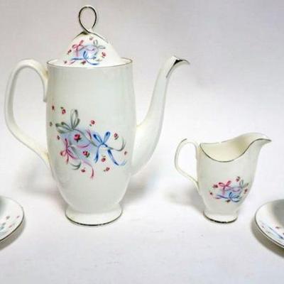 1029	ROYAL ALBERT TEAPOT, CREAMER. CUPS & SAUCERS *BUTTON & BOWS*
