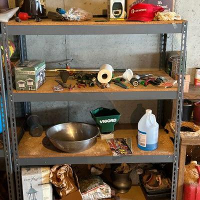 Multiple four level steel shelving units 