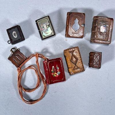 (8pc) MINIATURE WOOD-CARVED BOOKS | Mixed lot of carved wood miniature books including some with inlaid mother of pearl & abalone. -...