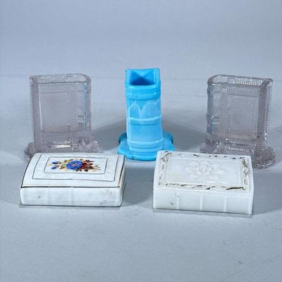(5pc) GLASS & CERAMIC BOOK-FORM VASES | Including: 3 book-form glass vases and 1 milk glass and 1 ceramic book-form vase. - h. 3 x w....