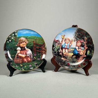 (2pc) Hummel Plates | M. J. Hummel porcelain plates by The Danbury Mint, including Apple Tree Boy and Girl and Favorite Pet, each with...