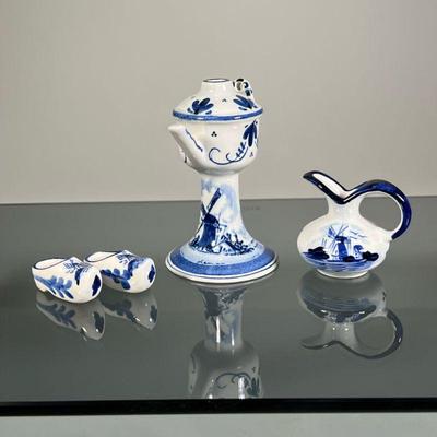 (4pc) DELFT-STYLE PORCELAIN | Dutch Delft-style blue and white porcelain including a wall ornament, a small open pitcher, and a pair of...