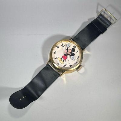 ELGIN DISNEY WATCH-FORM WALL CLOCK | Walt Disney wall clock with faux leather band in the form of a wristwatch with Mickey Mouse face...