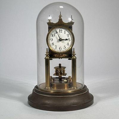 GUSTAV BECKER DOMED CLOCK | Glass domed German brass clock marked on back "Gustav Becker" - h. 8 x dia. 12 in

Contact All...