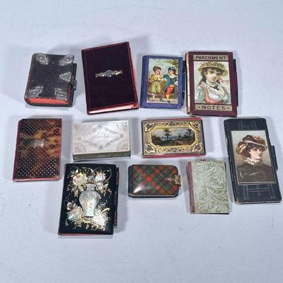 (11pc) ANTIQUE SMALL NOTEBOOKS | Mixed lot of antique notebooks including: mother of pearl, tooled leather, and more notebooks.

Contact...