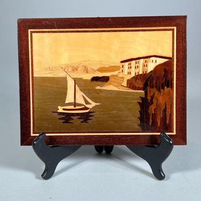 MARQUETRY PLAQUE | Seaside village landscape with sailboat. Inlaid with contrasting woods under varnish. - h. 6.75 x w. 8.75 in

Contact...