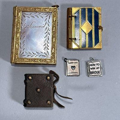 (5pc) MINIATURE NOTEBOOKS | Miniature notebooks including: Gilt & mother of pearl notebook, leather bound miniature notebook, and...
