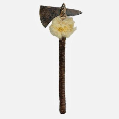Shoshone made mountain man style tomahawk. Raw steel, coyote fur, buckskin rawhide wrapped.