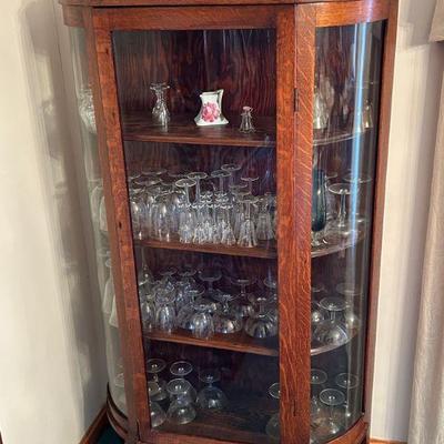 Gorgeous display cabinet with porcelain, glass and crystal pieces.