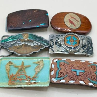 Vintage Belt Buckles including numbered buckle by Dale Larison, Brass works buckle featuring sailboat at sunset and more.