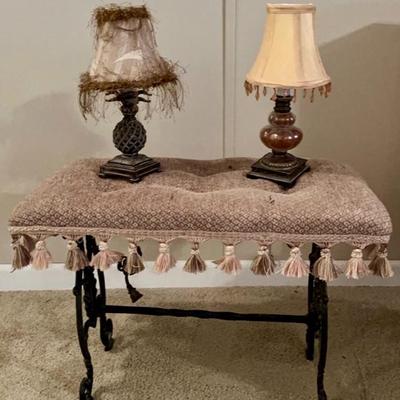 Vintage cast iron vanity bench in beige with tassels. with lamps
