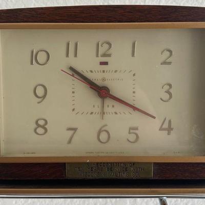 Vintage General Electric Plug In Clock With A Wisconsin Molting Co. 10 Year Service Plaque