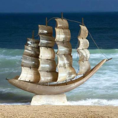 Carved horn sailboat