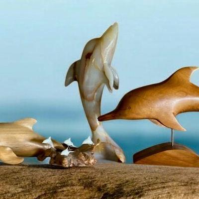 Carved wood and onyx dolphins terry woodall others