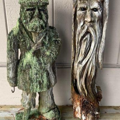 Carved wooden pirate and tree spirit