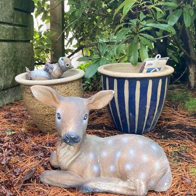 Cement deer statue and ceramic pots