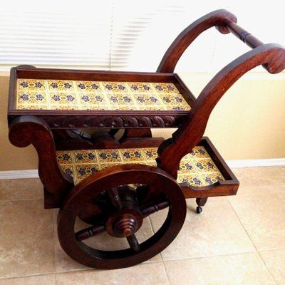 Carved mexican vendor cart with tile