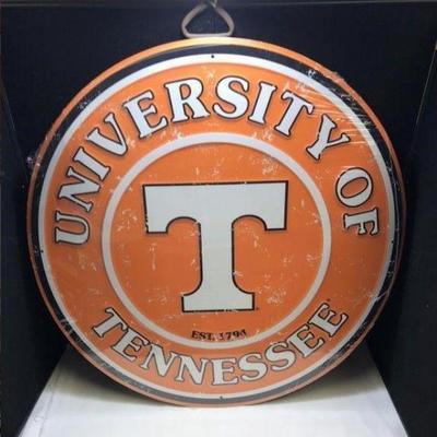 Lot # : 79 - Round Distressed Metal UT Sign
Sign measuring 23 1/2" round. Has College Brand hologram. 
