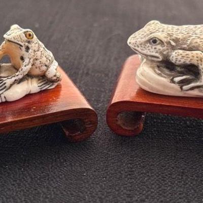 Antique japanese netsuke frogs on lily pad perched