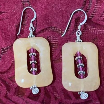 Carved stone earrings with bead accents