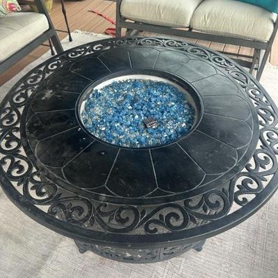 Upper deck fire pit with blue tempered glass.
