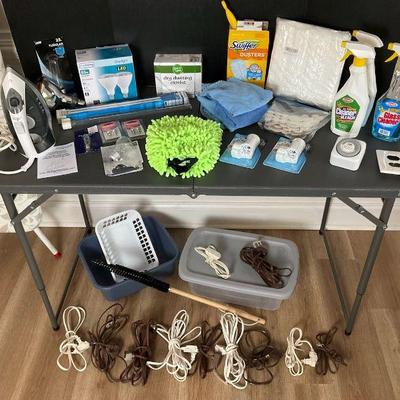 Household essentials bundle with cleaning supplies cords, and more