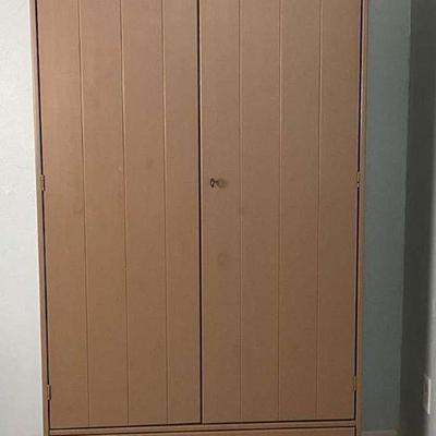 Rustic taupe wooden armoire with bottom drawer