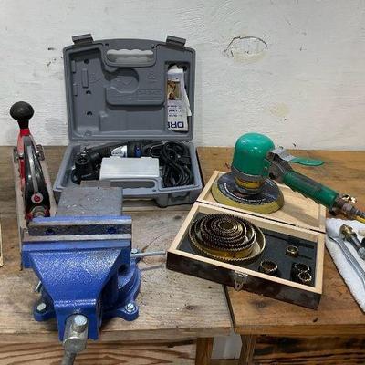 Versatile workshop tools collection including vise dremel, and more