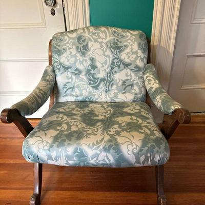 Low Armchair with Green Upholstery | Low to the ground armchair with wide arms, curved back and green upholstery. Seat height: 16"H...
