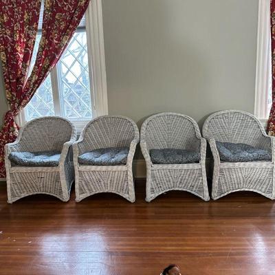 (4pc) White Wicker Armchairs | Set of four white painted wicker armchairs with blue and white seat cushions. - h. 34.5 x w. 27.5 in

