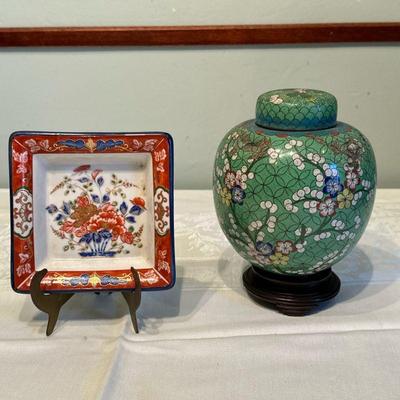 (2pc) Chinese Lidded Urn & Japanese Dish | Antique Chinese enamel lidded urn/ginger jar featuring floral patterns, atop a wooden...