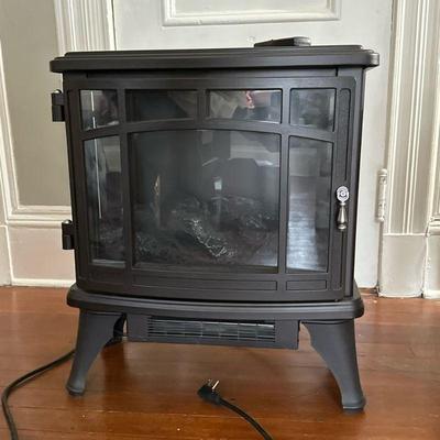 Portable Electric Fireplace | Portable electric fireplace in black finish with remote control. - h. 24 x w. 21 x d. 10 in

