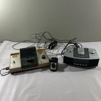 (2pc) Game Console & Alarm Clock | Vintage Magnavox Windsor TV game console with controllers and Curtis AM/FM Alarm Clock Radio.

