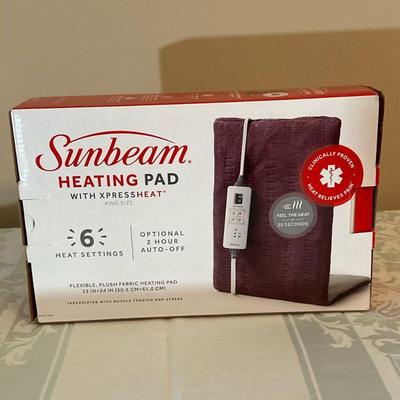 Sunbeam Heating Pad | Sunbeam king-sized heating pad with attached remote control.

