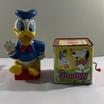(2pc) Donald Duck & Snoopy Toys | Vintage (1960's) Disney's Donald Duck piggy bank and Mattel's Snoopy wind-up music...