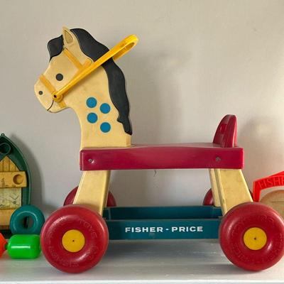 Fisher-Price Ride-On Horse & Toys | Vintage (1970's/80's) Fisher-Price toys including ride-on horse, rattle ball roller,...