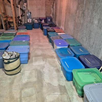 Bins are full of women's clothing. Sizes small, medium and large 