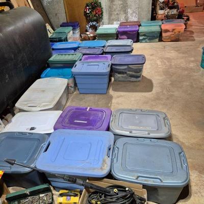 Bins are full of women's clothing. Sizes small, medium and large