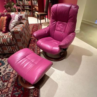 Leather armchair with footstool