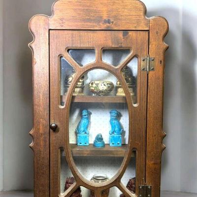 Wood curio cabinet with foo dogs moriage vases