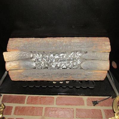 Faux log insert that goes with faux fireplace. This does not produce heat!
